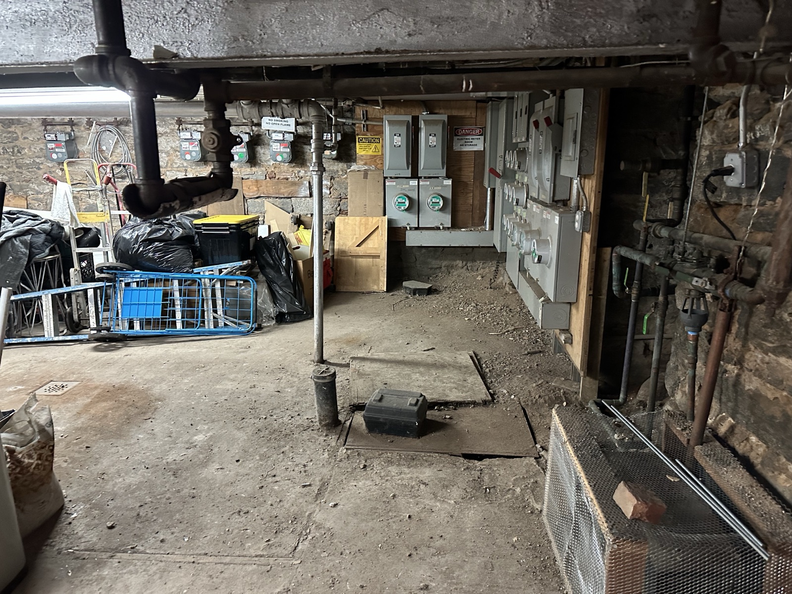 Utility and service conditions in the basement at 84 Clinton during renovation work.